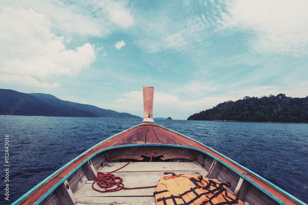 Sticker boat floating on tropical ocean in thailand, vintage tone