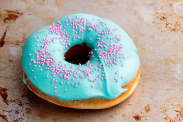 donut with turquoise frosting