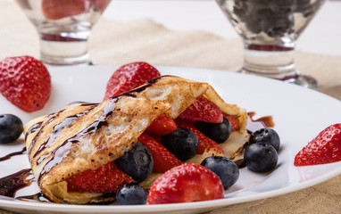 pancake with fruits and chocolate syrup