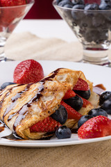 pancake with fruits and chocolate syrup