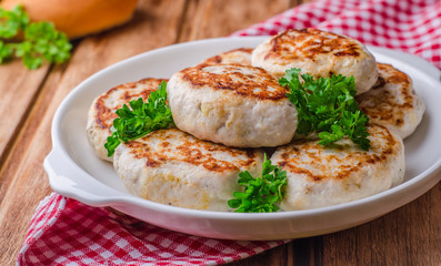 Chicken Cutlets on wooden background. Selective focus