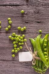 peas on a wood table with tag