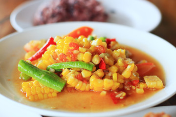 Spicy corn salad with roasted peanuts. Thai style food.