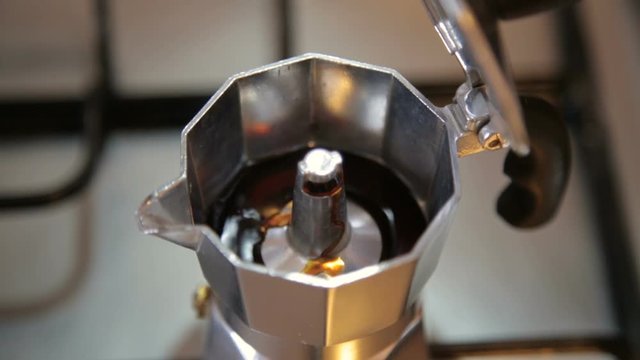 Coffe is Coming out from the Coffe Machine