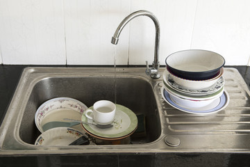 Fototapeta na wymiar Dirty of dish and kitchenware waiting for wash