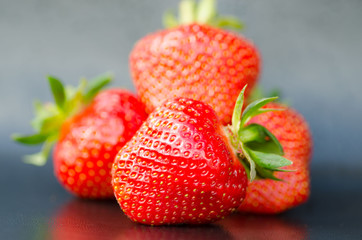 Fresh sweet strawberry on black