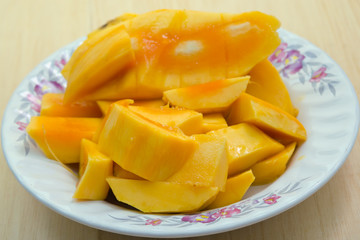 Sliced ripe yellow mango served on the dish