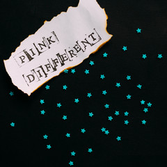 "pink different" message of woman strenght with little candy stars