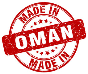 made in Oman red grunge round stamp