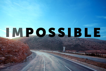 Changing the word impossible to possible on asphalt road © Africa Studio