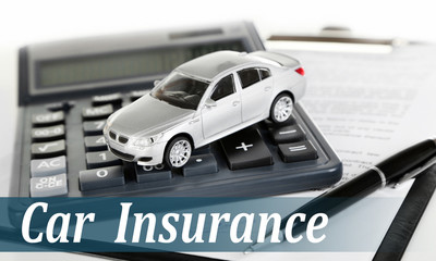 Car insurance concept. Tablet, calculator and toy car