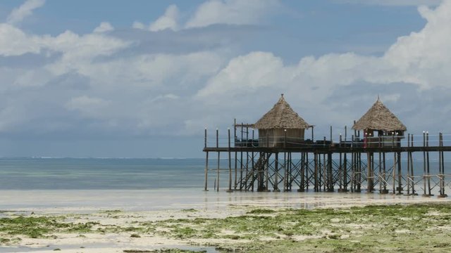 Nice bamboo huts in the turquoise Sea of Zanzibar