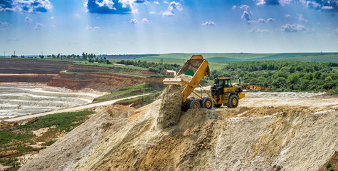 Kaolin quarry with white gypsum material and truck - obrazy, fototapety, plakaty