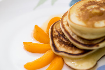 Fototapeta na wymiar pancakes with honey and apricot