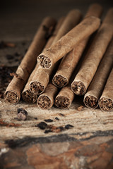 Cigars pile on wood