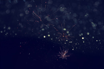 abstract holiday background, glitter lights and firework overlay