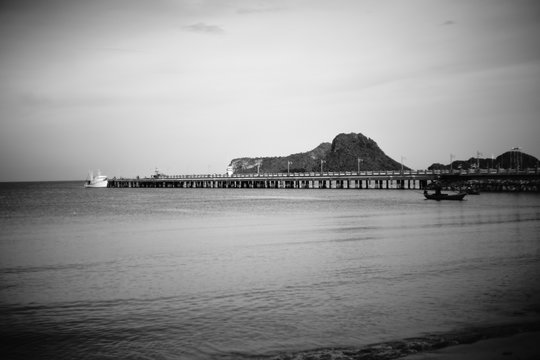 Fototapeta bridge name's "Sa-pan-sa-ran-wi-tee" sea bridge and peace wave in black and white picture style prachaupkririkhan, thailand