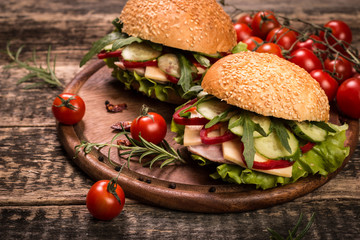 home made burger on vintage wooden background