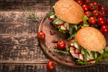 home made burger on vintage wooden background