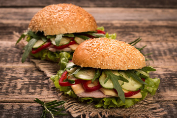 home made burger on vintage wooden background