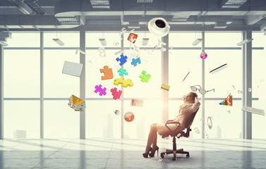 Businesswoman having rest in office