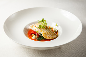 Grilled turbot, tabouli, sweet pepper sauce and summer vegetables. White dish