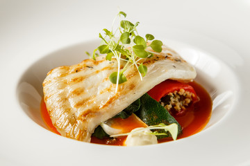 Grilled turbot, tabouli, sweet pepper sauce and summer vegetables. White dish