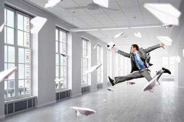 Dancing businessman in office