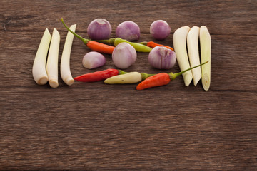 Spices , chilli , shallot , lemongrass on a wooden floor. Thai i