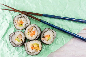 Sushi rolls and chopsticks