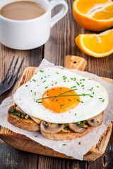 Breakfast: fried egg with mushrooms and pesto on toast