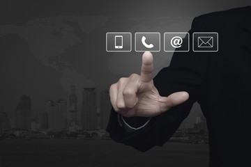 Businessman pressing telephone, mobile phone, at and email butto