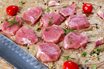 Raw pork tenderloin on crumpled paper. ready to cook.