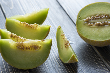 Fresh melons on wooden table