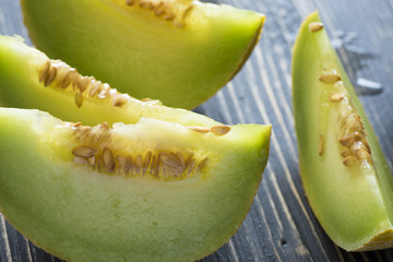 Fresh melons on wooden table