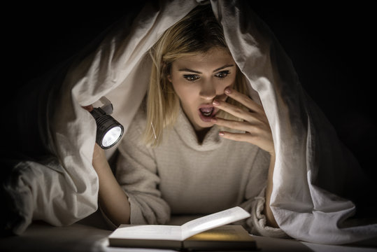 Girl Reading Horror Book