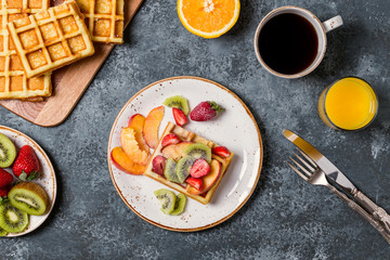 Fototapeta na wymiar Breakfast waffles with fresh fruit.