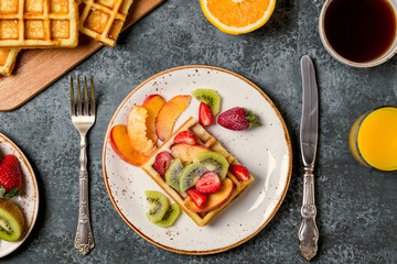 Breakfast waffles with fresh fruit.