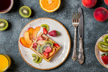 Breakfast waffles with fresh fruit.