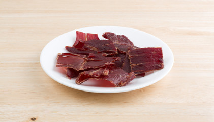 Hardwood smoked beef jerky on white plate