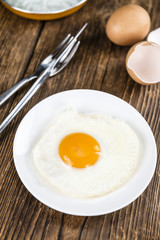 Fried Eggs on wooden background