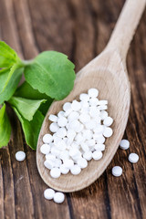 Stevia sweetener on wooden background