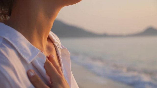 Sexy Sensual Woman at Beach near Sea Touching Her Neck