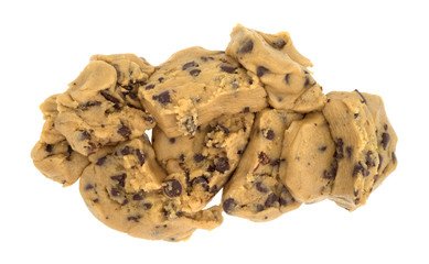 Chocolate chip cookie dough chunks isolated on a white background.