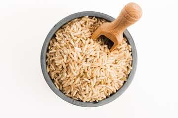Fototapeta na wymiar brown rice in a bowl isolated on white background