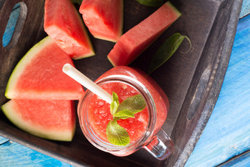 watermelon smoothie on blue wooden table