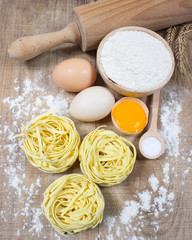 Raw homemade pasta and ingredients for pasta.