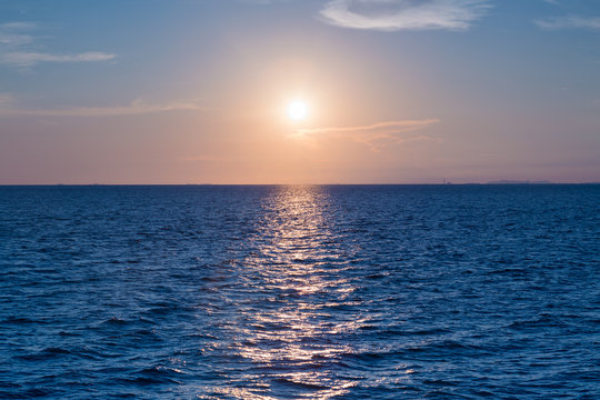 Fototapeta Sunset over ocean skyline, natural landscape background