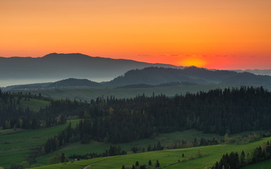 Fototapeta na wymiar Moments before sunrise in misty Carpathian mountains, spring, Poland