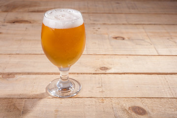 Beer glass on wood